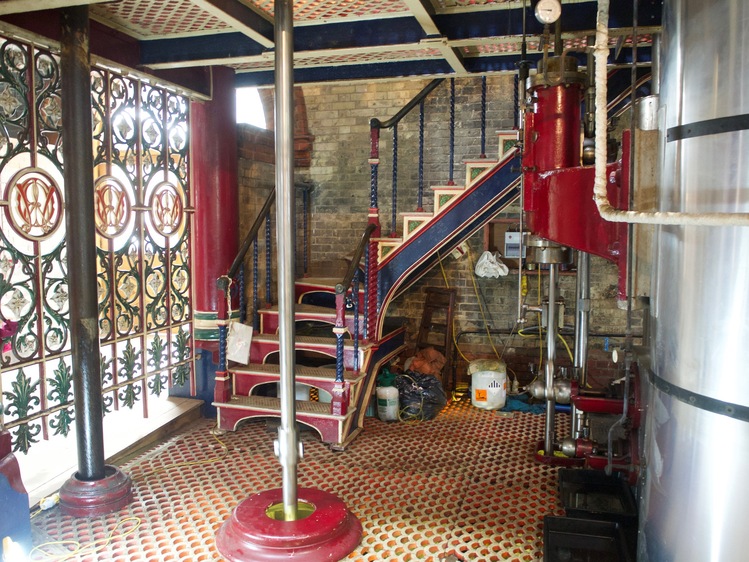 Some steps up to another level, with blue, red and cream decoration.